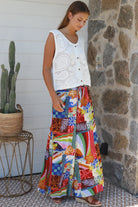 Bright 70s patchwork rayon wide-leg pants in bold multicoloured print — Ingrid Pant summer boho style.