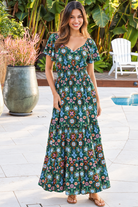 Emily bohemian maxi dress in green rayon with flutter sleeves tiered skirt and shirred back