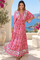 Eliana Bloom pink floral rayon boho maxi dress with V-neckline, smocked waist and tiered skirt.