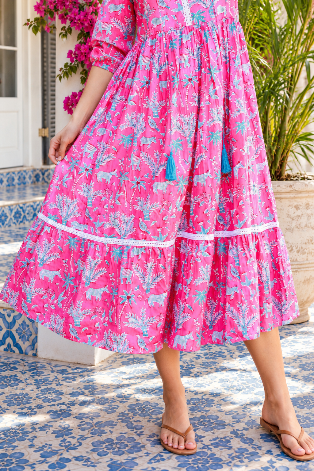 Mahale Sanctuary Midi Dress Pluto Pink in 100% cotton with turquoise wildlife print, white lace trim and frill hem
