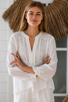  Paige white embroidered blouse by Salty Palm with floral panels, split neckline and long relaxed sleeves