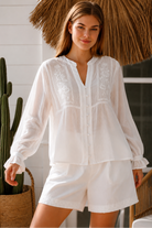  Paige white embroidered blouse by Salty Palm with floral panels, split neckline and long relaxed sleeves