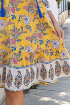 Golden Dahlia Peacock Feather cotton boho dress with cobalt tassels and ornate floral border print