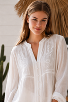  Paige white embroidered blouse by Salty Palm with floral panels, split neckline and long relaxed sleeves