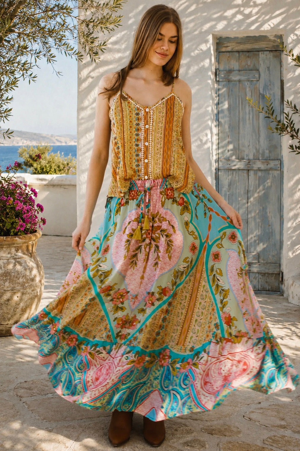 Amara floral boho maxi skirt in 100% rayon with colourful placement print, gathered frill hem and tassel tie