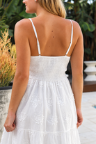 Olivia white embroidered cotton maxi dress with lace waist, tassel V-neck, adjustable straps and tiered skirt