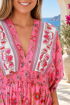 Eliana Bloom pink floral rayon boho maxi dress with V-neckline, smocked waist and tiered skirt.