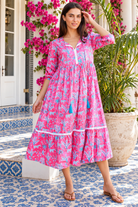 Mahale Sanctuary Midi Dress Pluto Pink in 100% cotton with turquoise wildlife print, white lace trim and frill hem