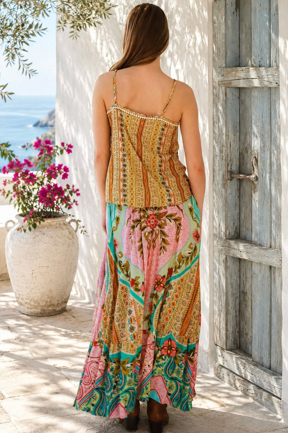 Amara floral boho maxi skirt in 100% rayon with colourful placement print, gathered frill hem and tassel tie
