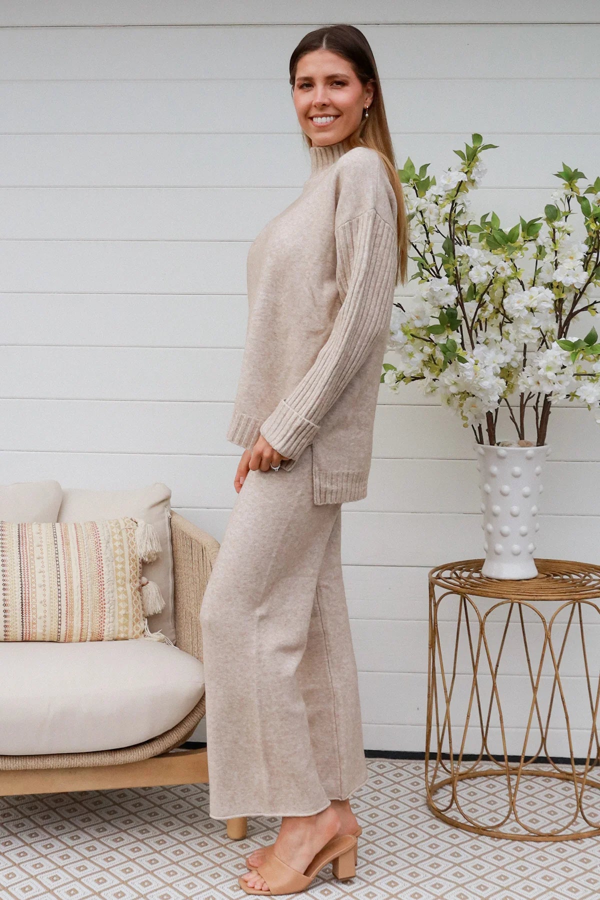 Woman in vanilla knit lounge set with ribbed sweater and wide-leg pants - boho knitwear co-ord set - Bohemian Love Runway.