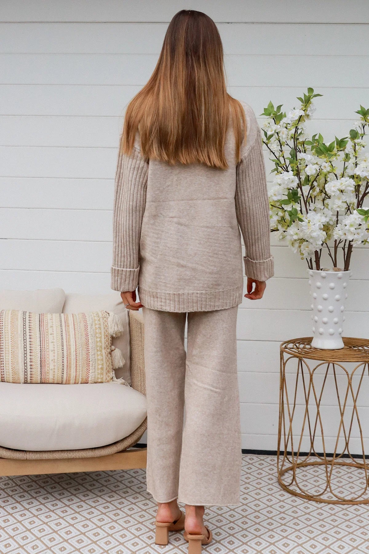 Woman in vanilla knit lounge set with ribbed sweater and wide-leg pants - boho knitwear co-ord set - Bohemian Love Runway.