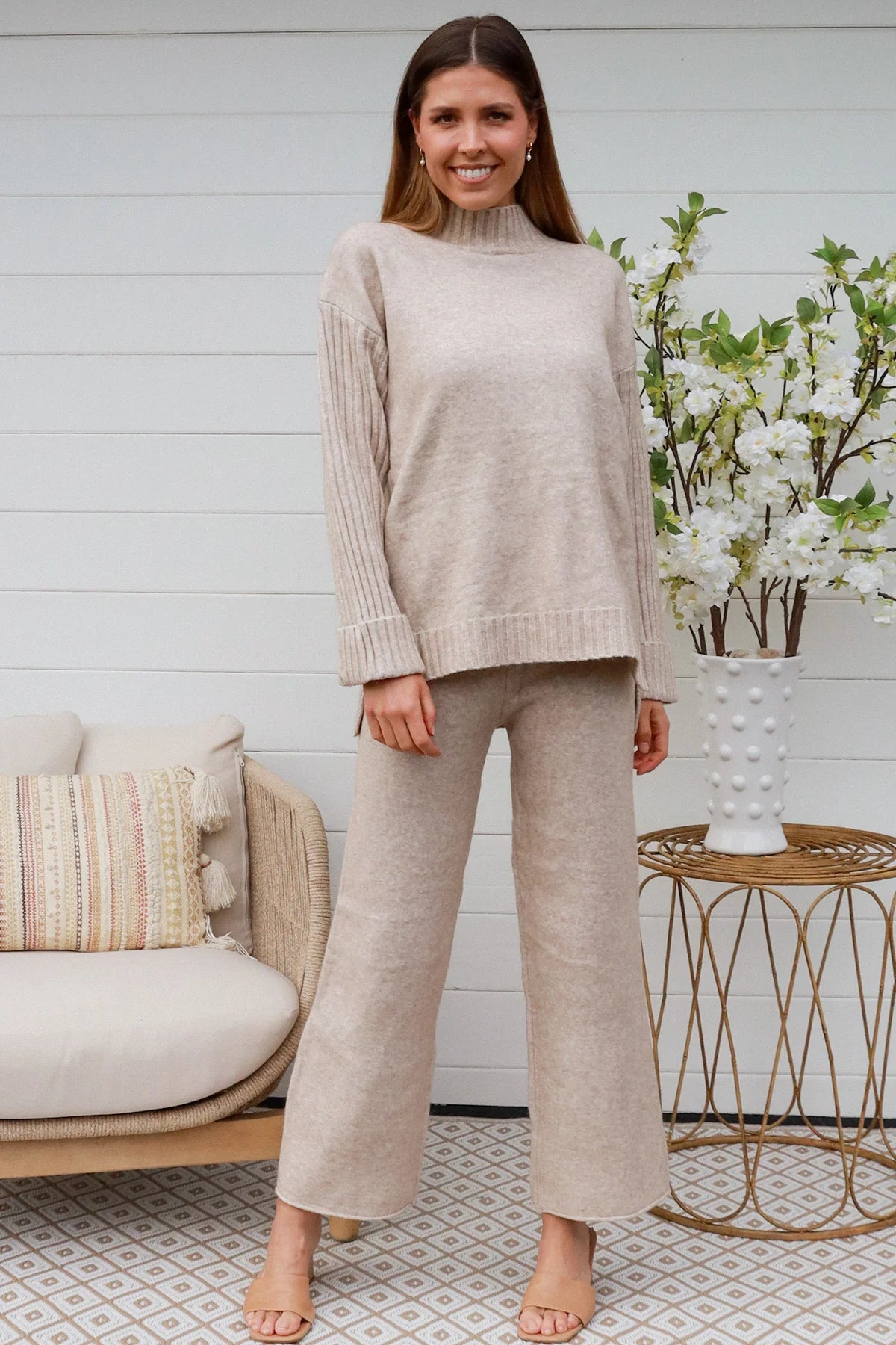Woman in vanilla knit lounge set with ribbed sweater and wide-leg pants - boho knitwear co-ord set - Bohemian Love Runway.