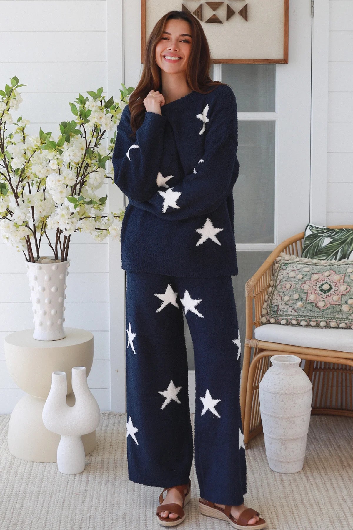 Charlotte The Label Star Soft Brushed Knit Pants in navy featuring a soft brushed knit, closely placed white star design, wide-leg silhouette and elastic waistband.