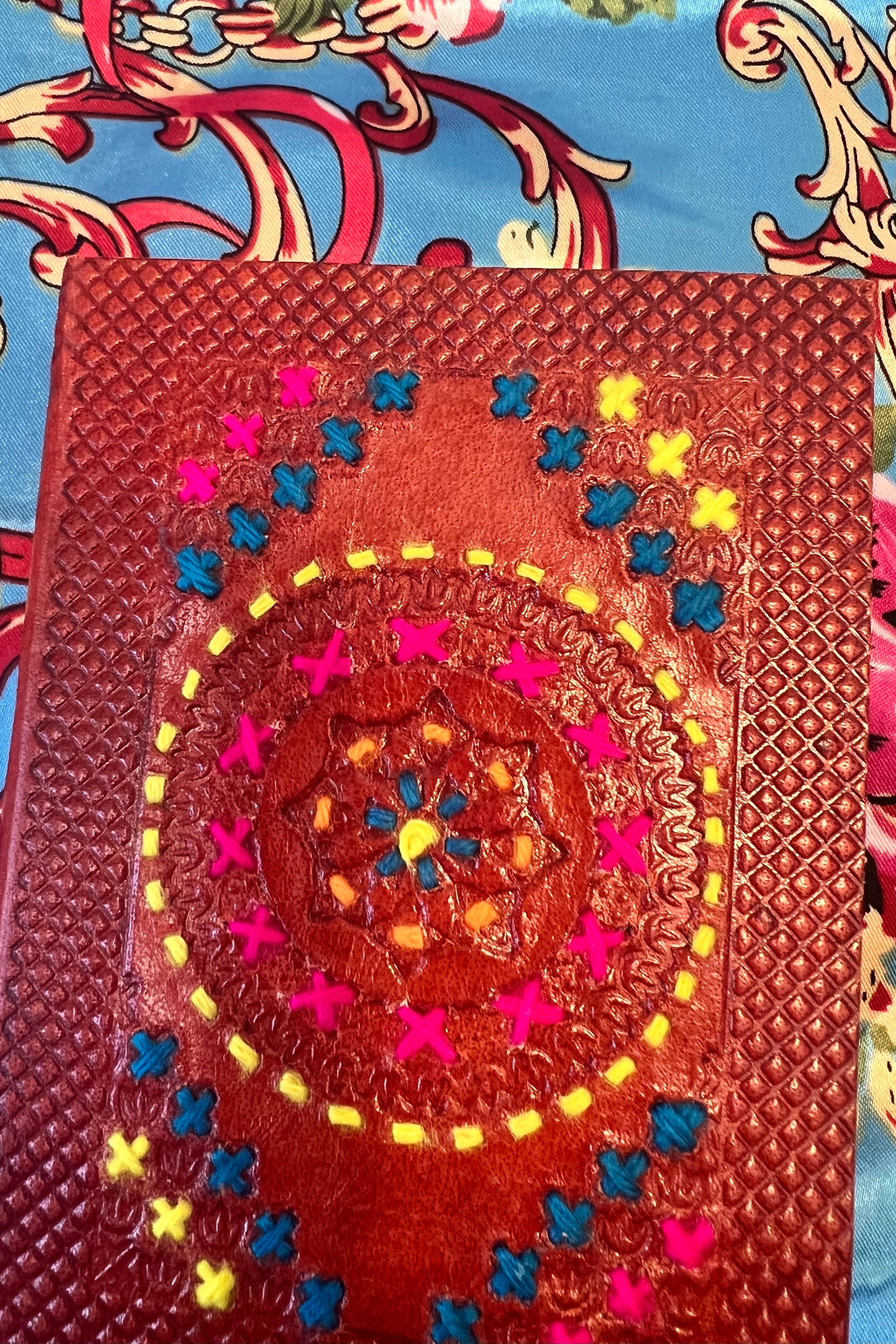 Hand-tooled leather B5 journal with colourful embroidered mandala and sky-blue ribbon - artisan boho notebook.