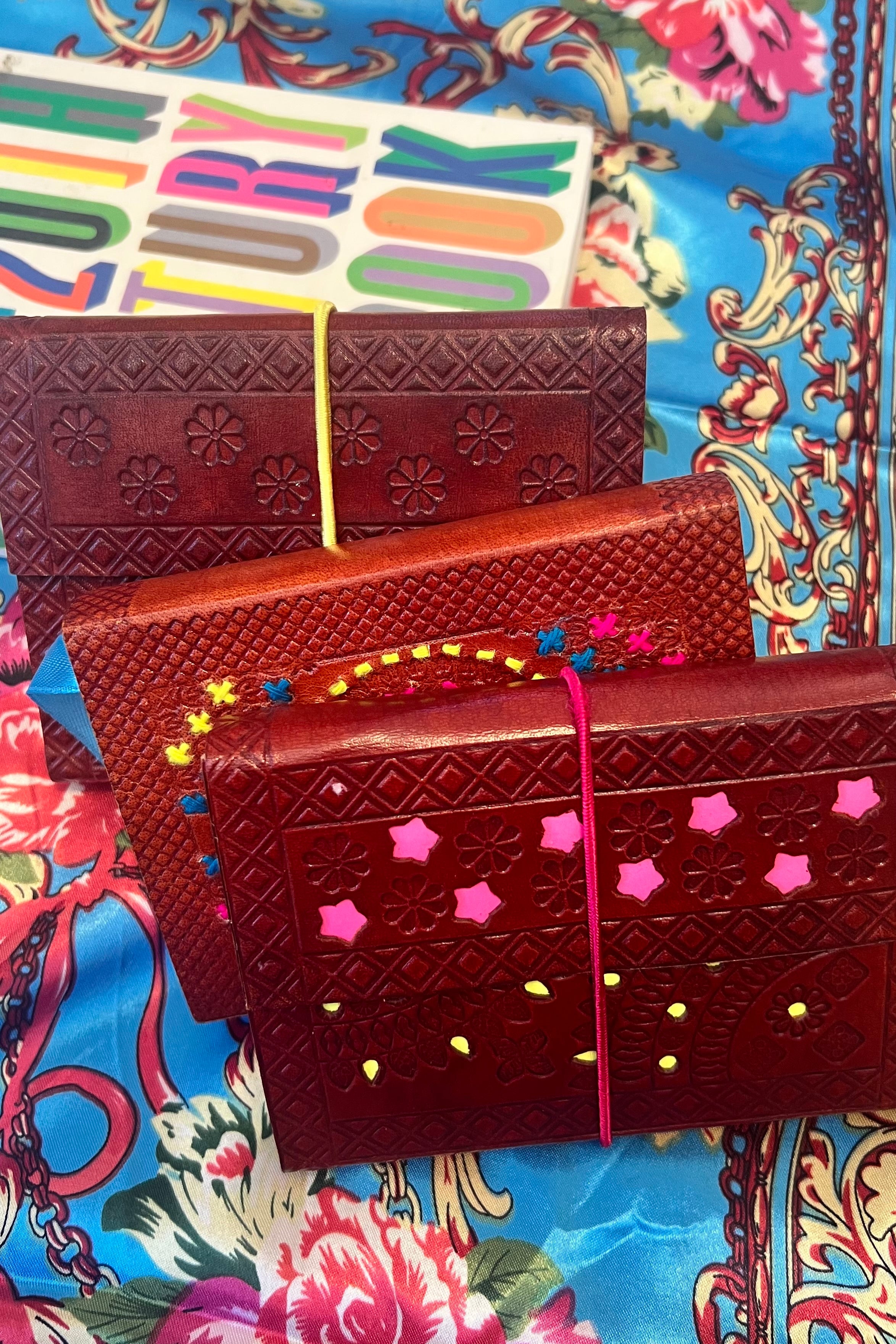 Hand-tooled leather B5 journal with colourful embroidered mandala and sky-blue ribbon - artisan boho notebook.