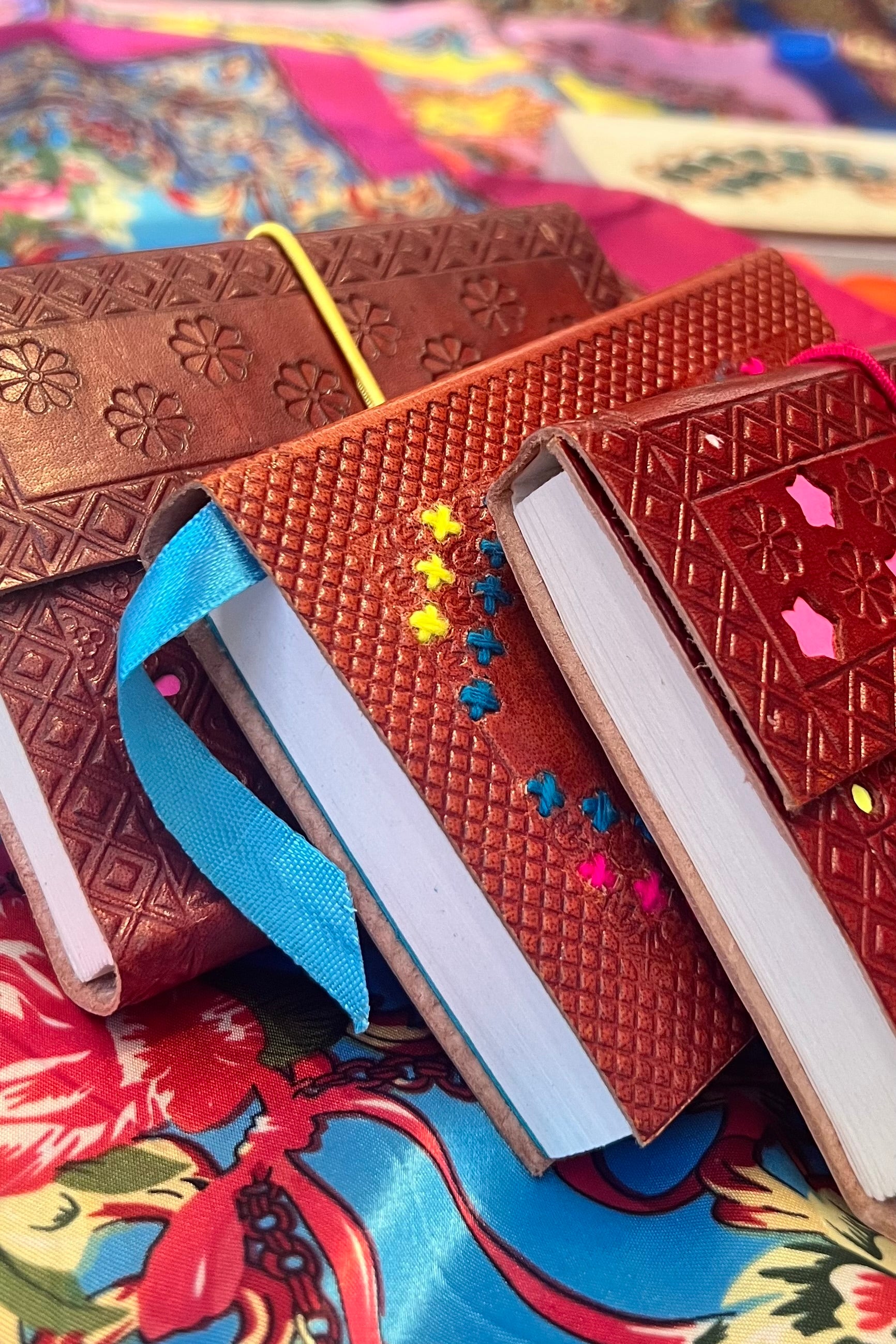 Hand-tooled leather B5 journal with colourful embroidered mandala and sky-blue ribbon - artisan boho notebook.