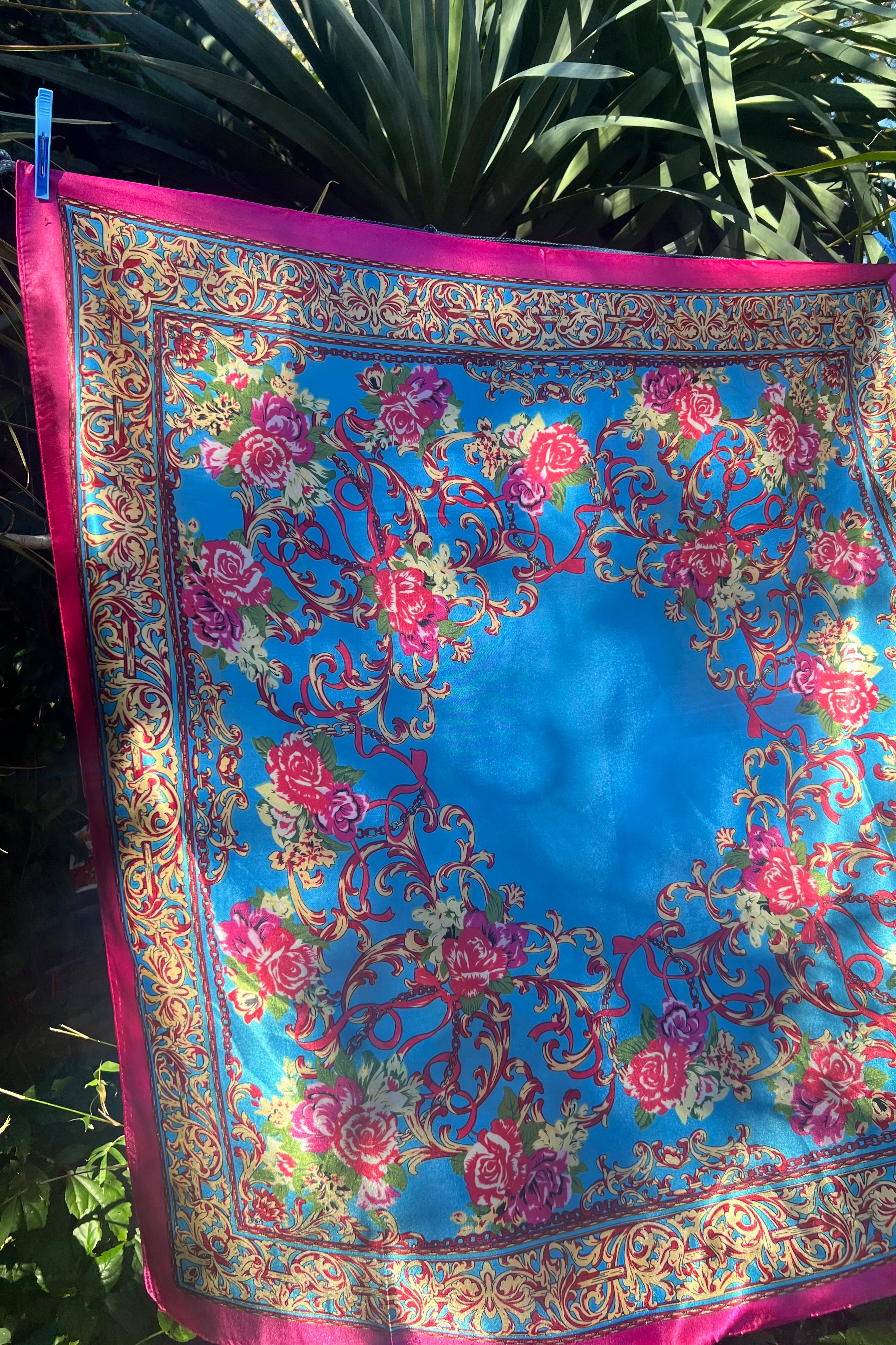 Cerulean scarf with gold scrolls, pink and crimson rose, and a fuchsia border. 90x90cm. Silk satin feel.