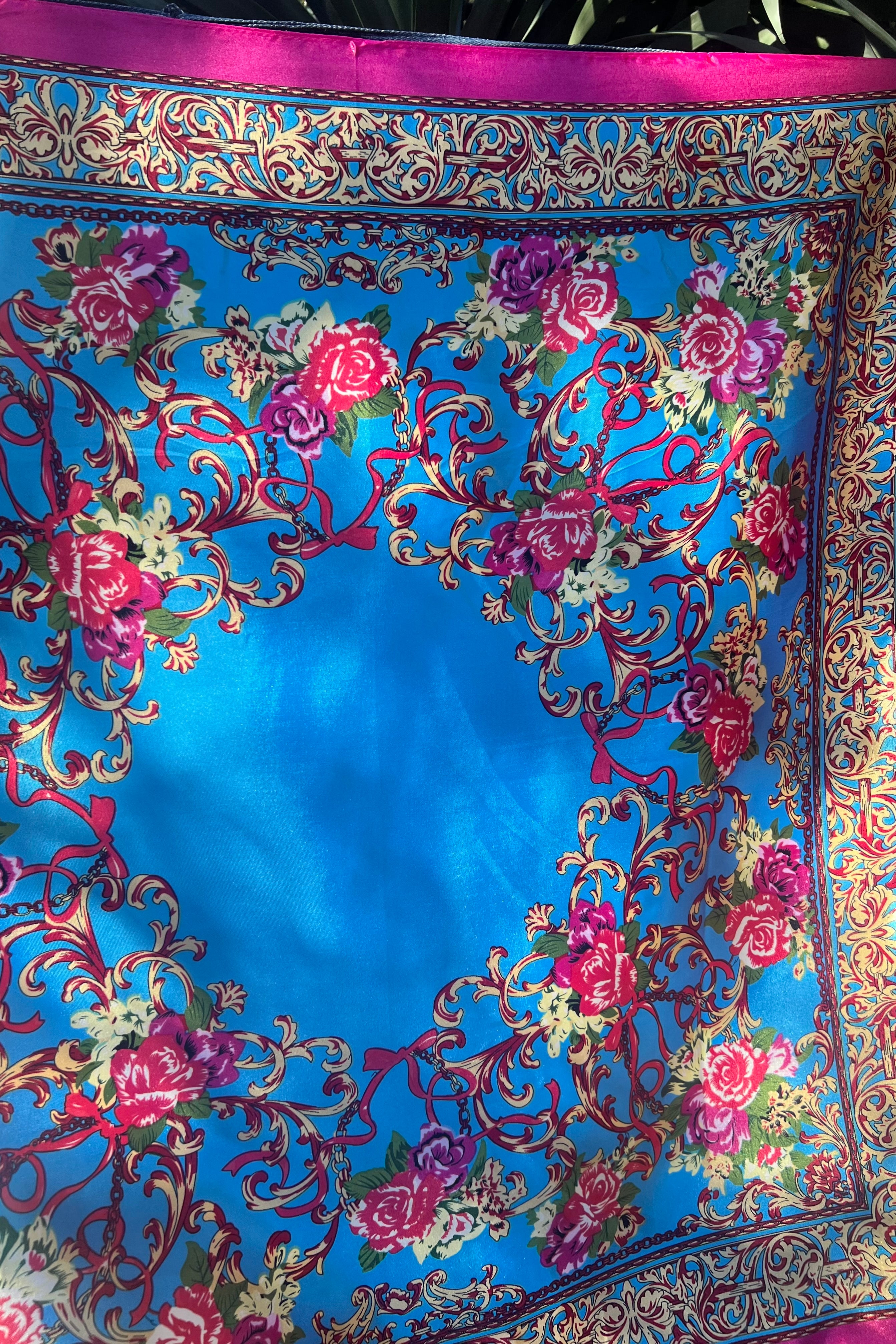 Cerulean scarf with gold scrolls, pink and crimson rose, and a fuchsia border. 90x90cm. Silk satin feel.