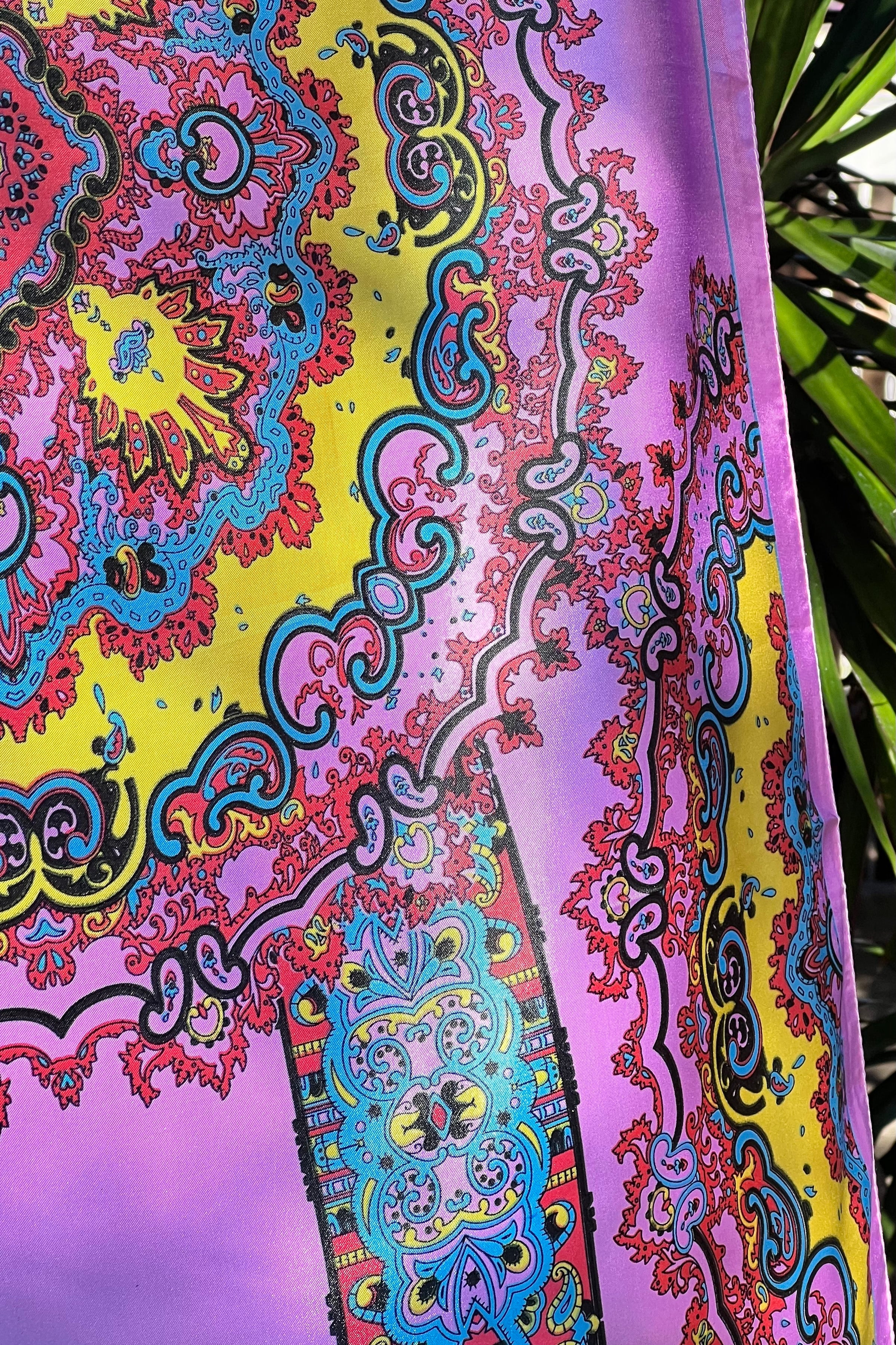 Bright silk satin scarf with paisley and mandala print in lilac, yellow, coral and teal. 90x90cm. Polyester with luxe sheen.