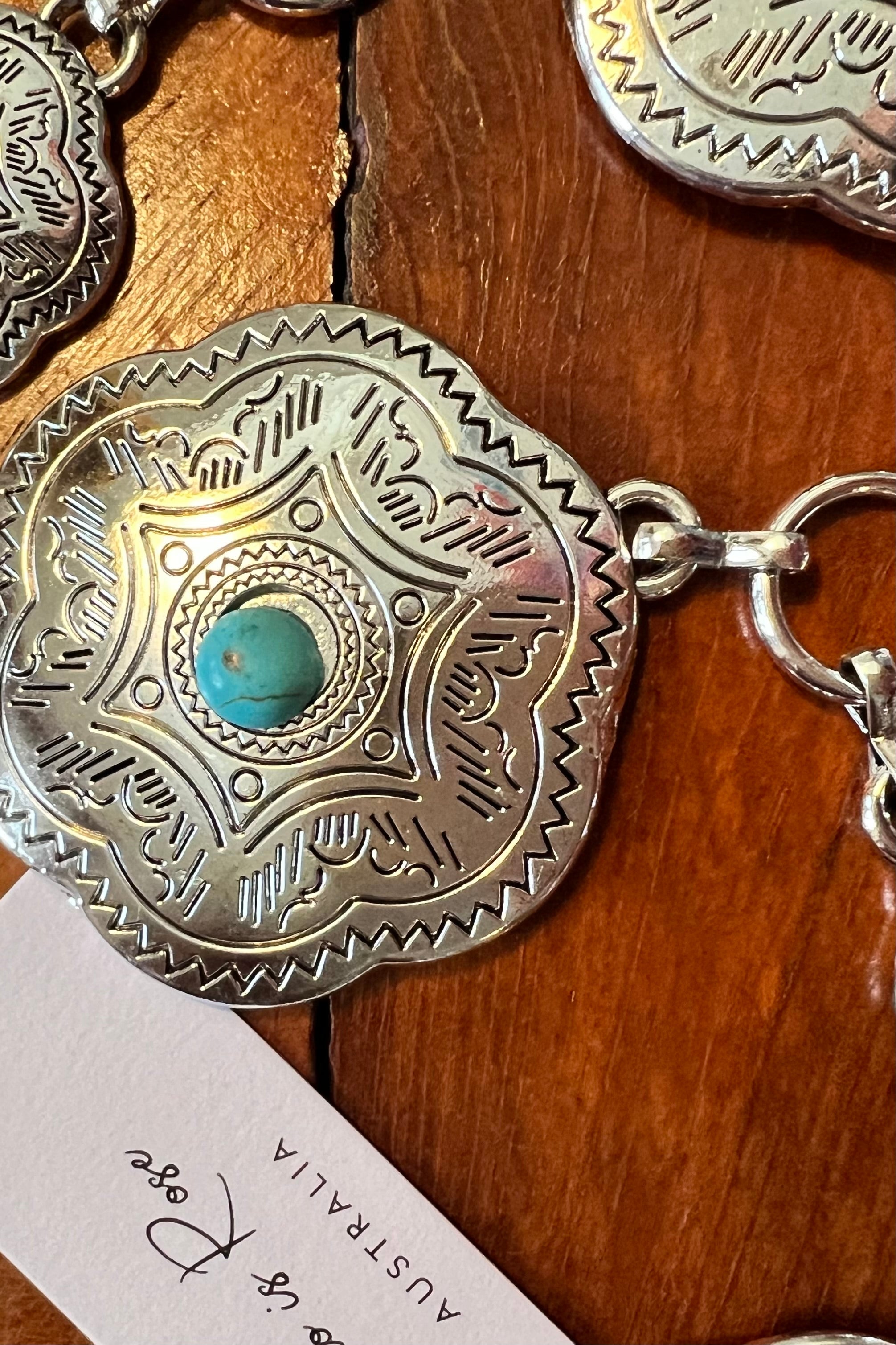 Western festival silver concho chain belt with turquoise stones - boho accessory at Bohemian Love Runway.