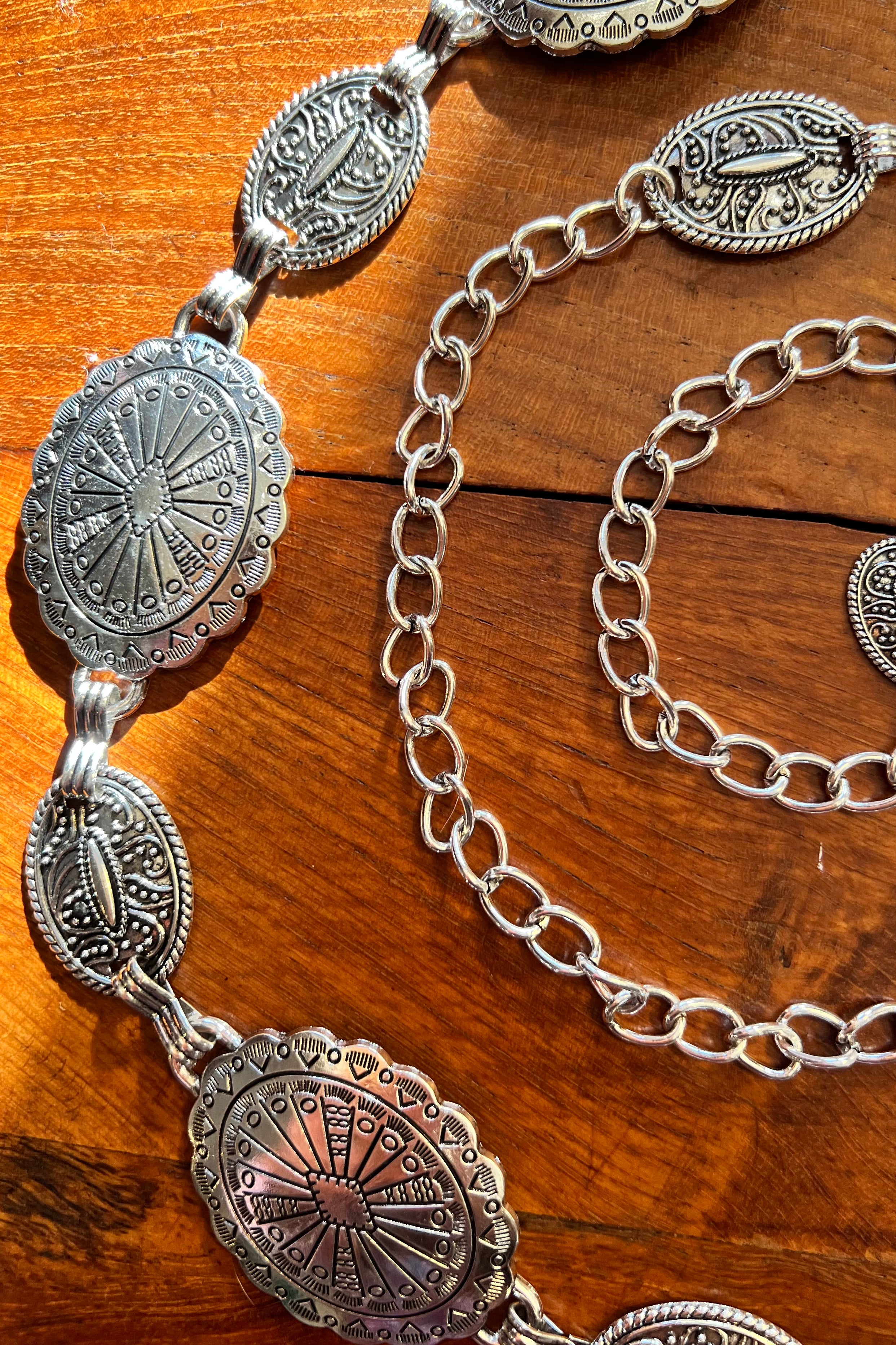 Silver finish concho chain belt with engraved oval medallion and extender - boho festival waist belt Australia.