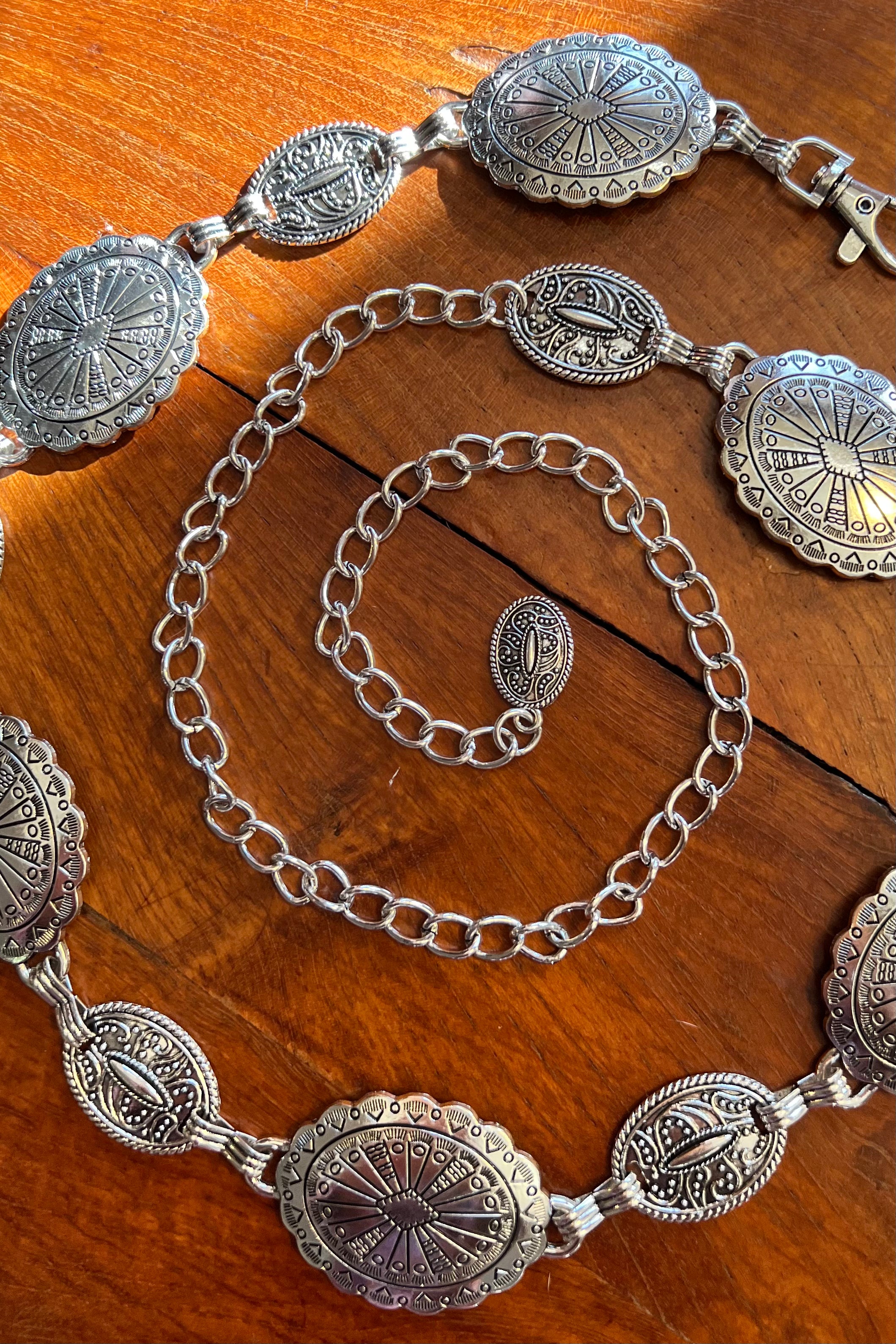 Silver finish concho chain belt with engraved oval medallion and extender - boho festival waist belt Australia.