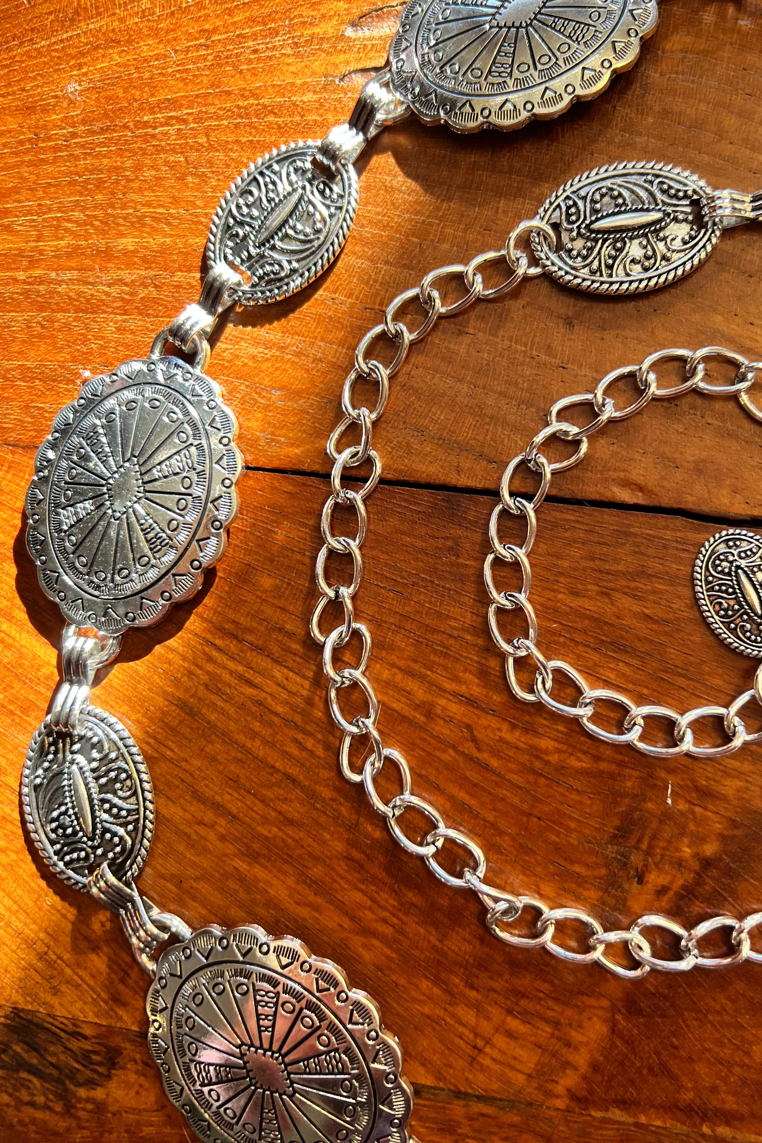 Silver finish concho chain belt with engraved oval medallion and extender - boho festival waist belt Australia.