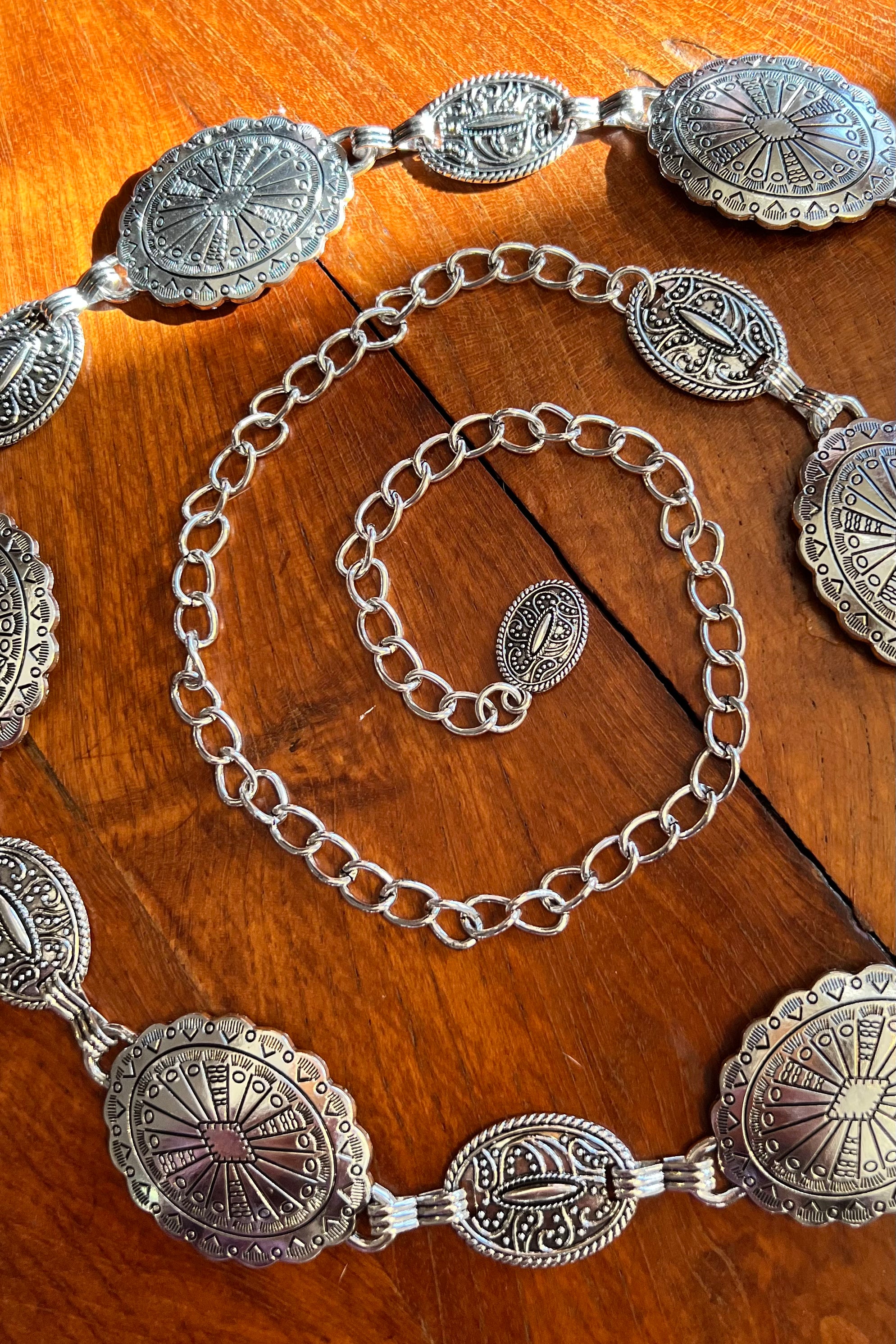 Silver finish concho chain belt with engraved oval medallion and extender - boho festival waist belt Australia.