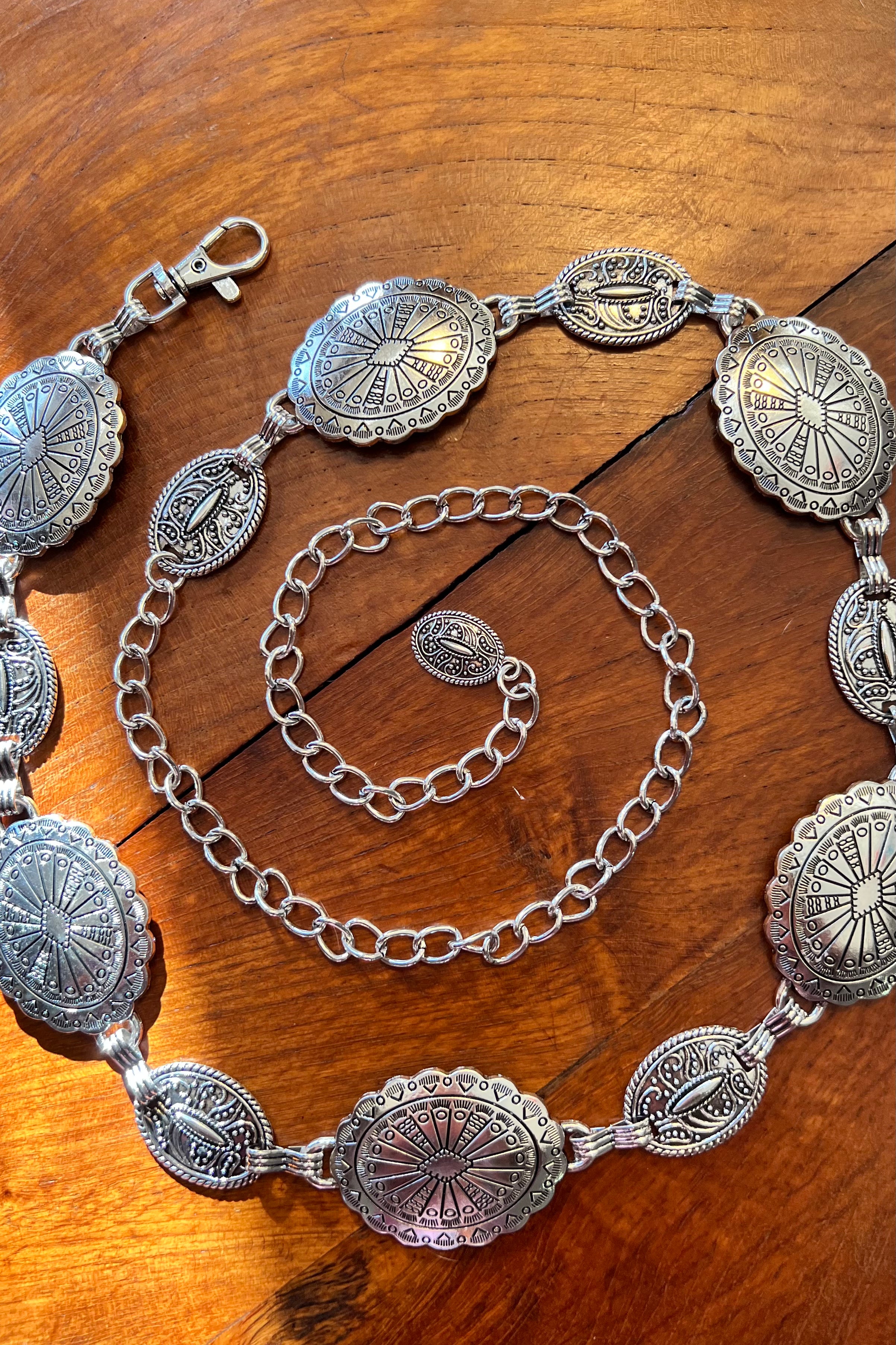 Silver finish concho chain belt with engraved oval medallion and extender - boho festival waist belt Australia.