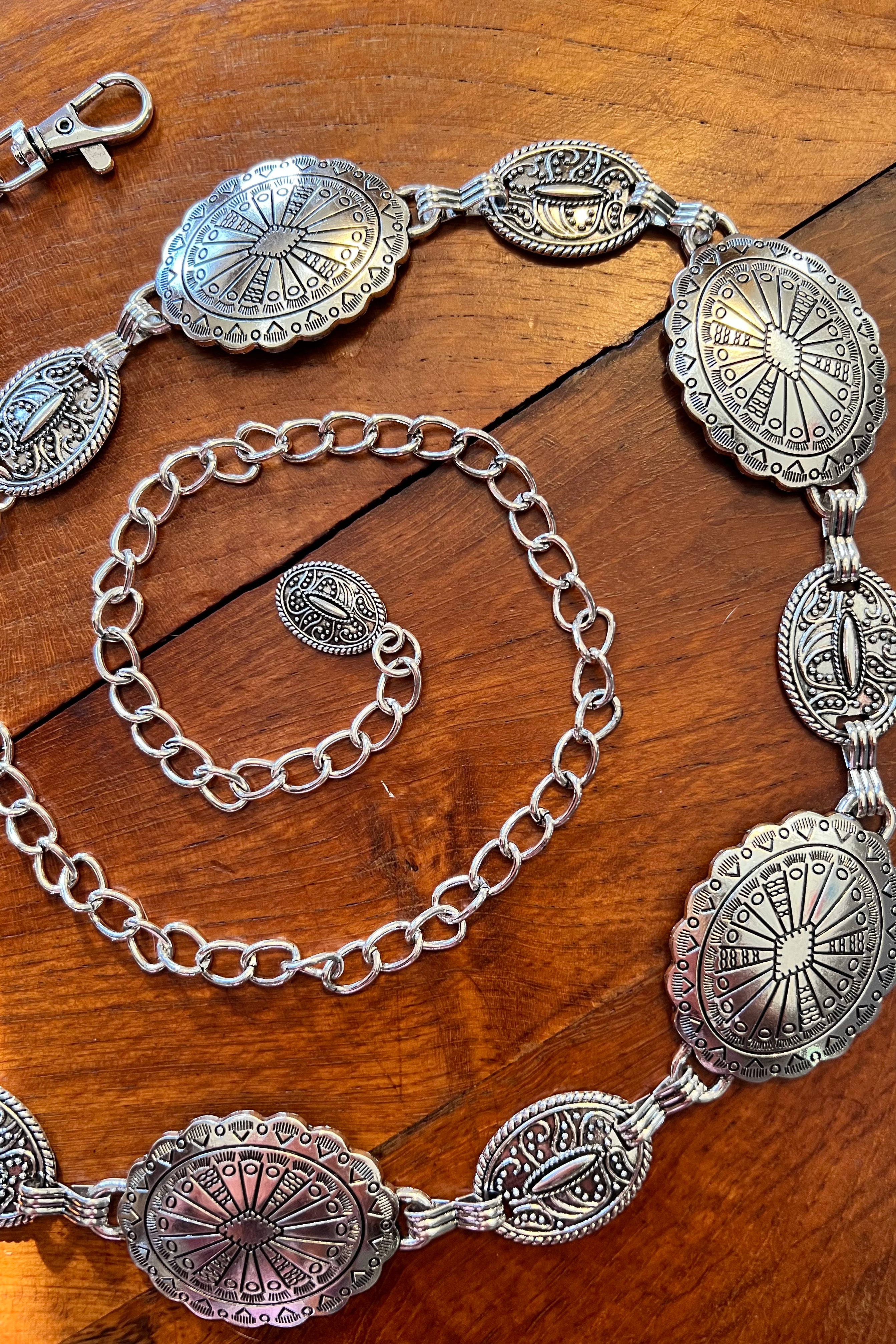 Silver finish concho chain belt with engraved oval medallion and extender - boho festival waist belt Australia.