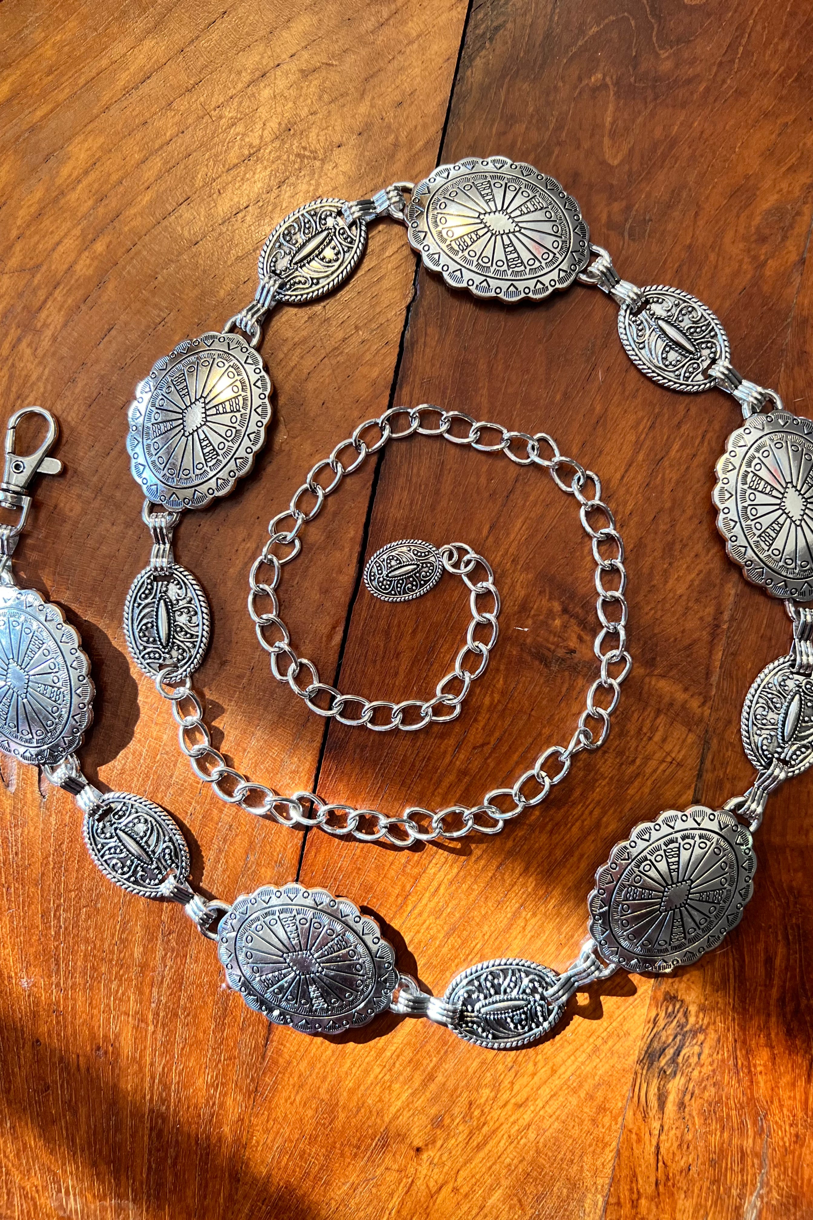 Silver finish concho chain belt with engraved oval medallion and extender - boho festival waist belt Australia.