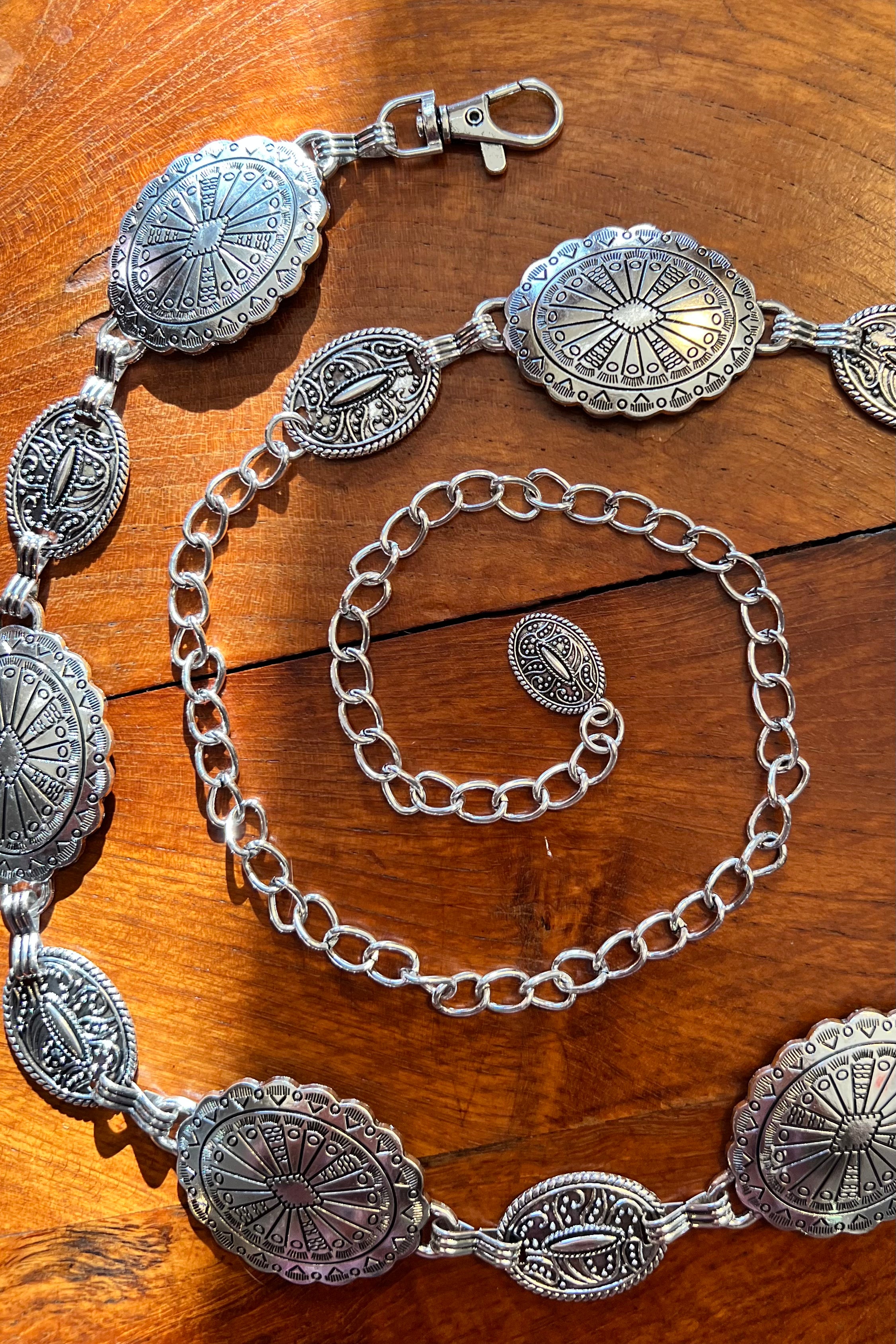 Silver finish concho chain belt with engraved oval medallion and extender - boho festival waist belt Australia.
