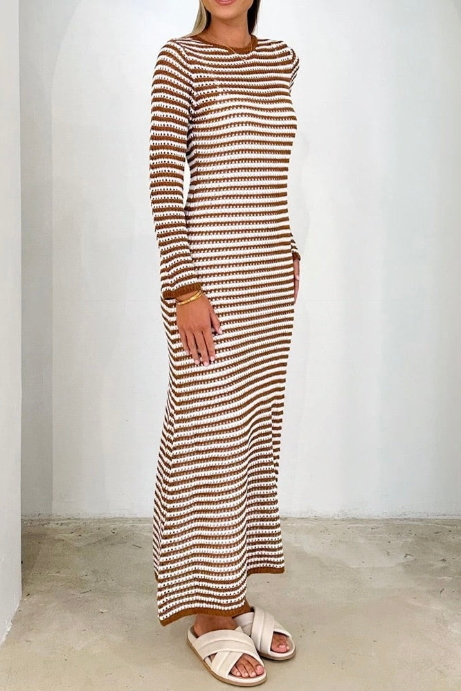 Woman wearing brown and white striped knit maxi dress with long sleeves and round neckline - boho cotton bodycon dress Australia.