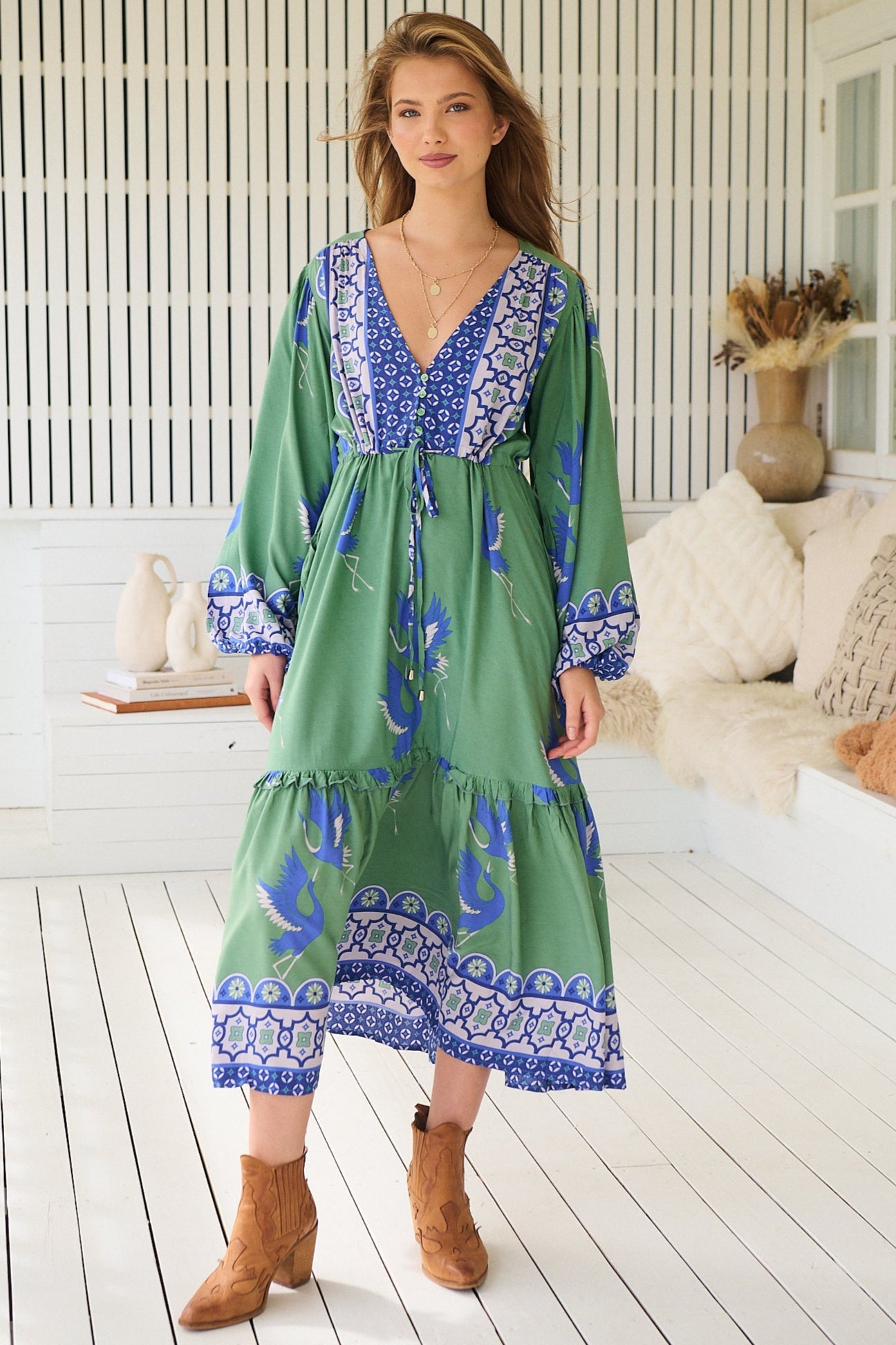 Model wearing Bluebird Willa Boho Midi Dress by Jaase - floral print, long sleeves, 100% rayon, relaxed fit.