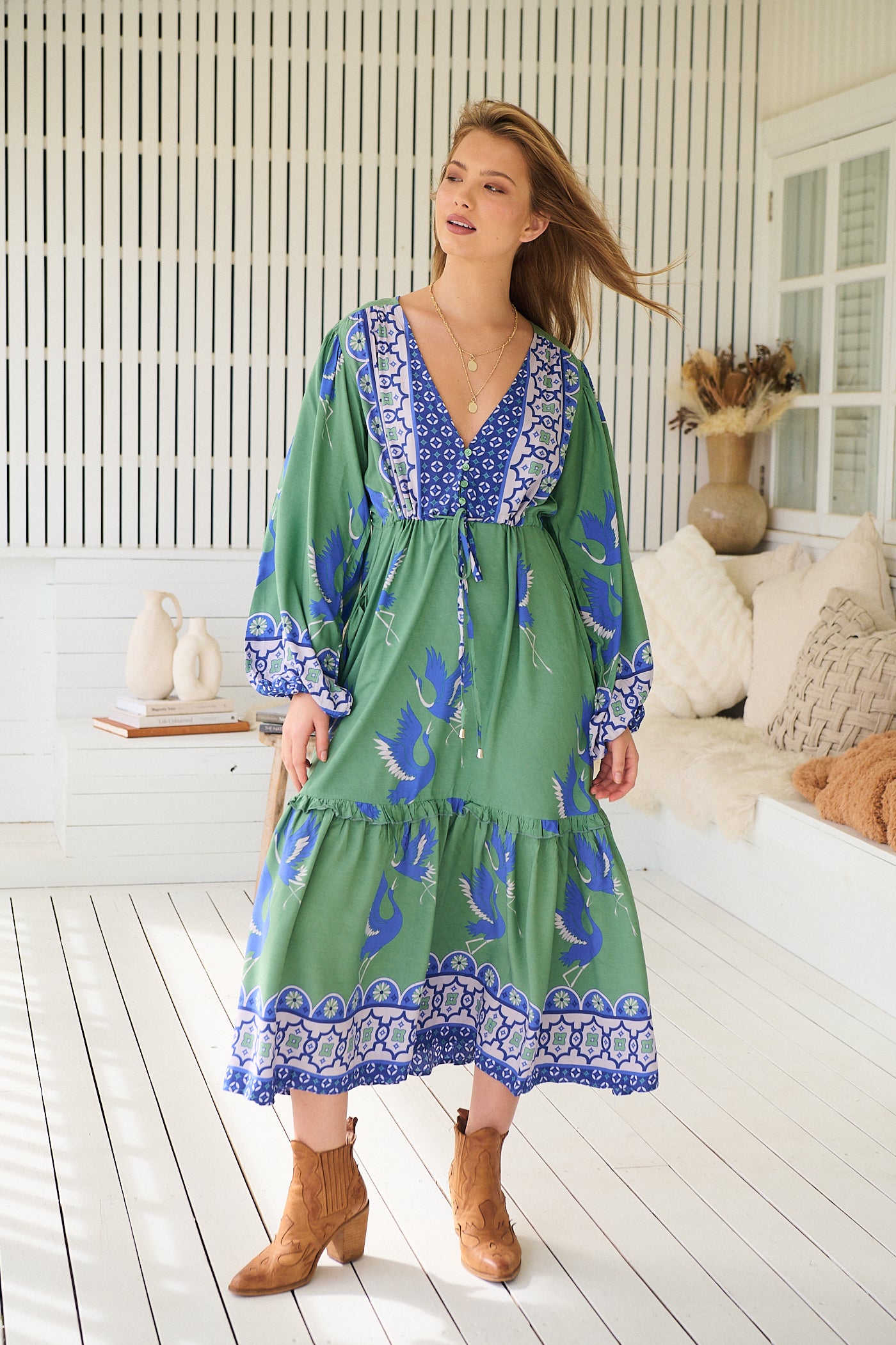Model wearing Bluebird Willa Boho Midi Dress by Jaase - floral print, long sleeves, 100% rayon, relaxed fit.