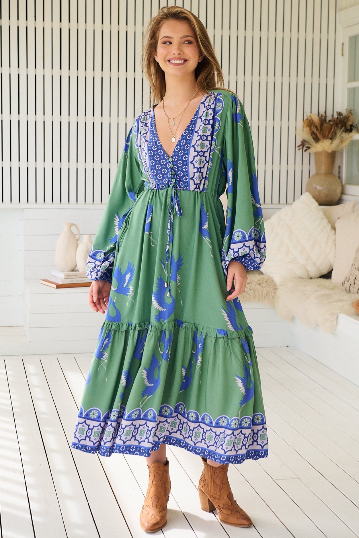 Model wearing Bluebird Willa Boho Midi Dress by Jaase - floral print, long sleeves, 100% rayon, relaxed fit.