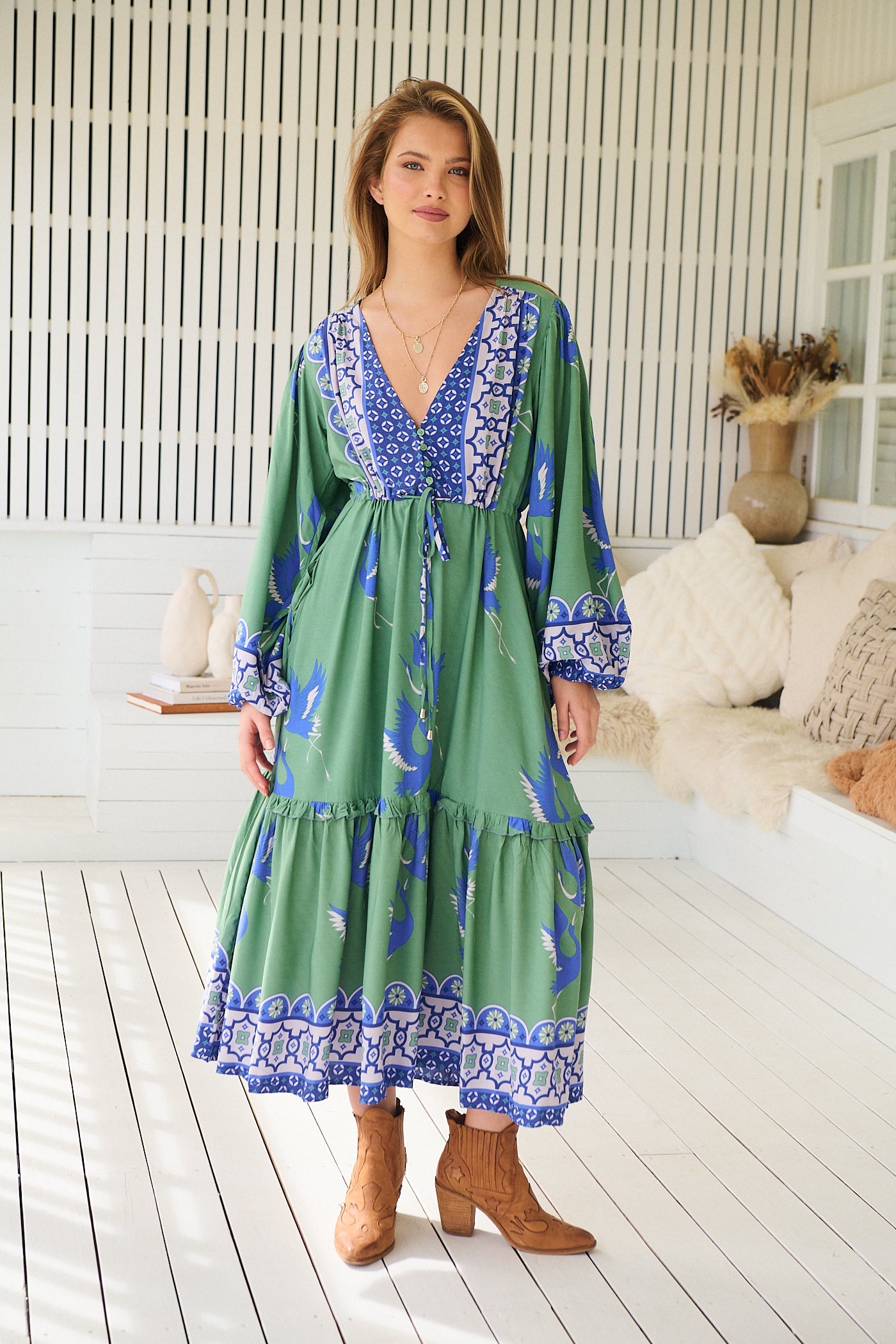 Model wearing Bluebird Willa Boho Midi Dress by Jaase - floral print, long sleeves, 100% rayon, relaxed fit.