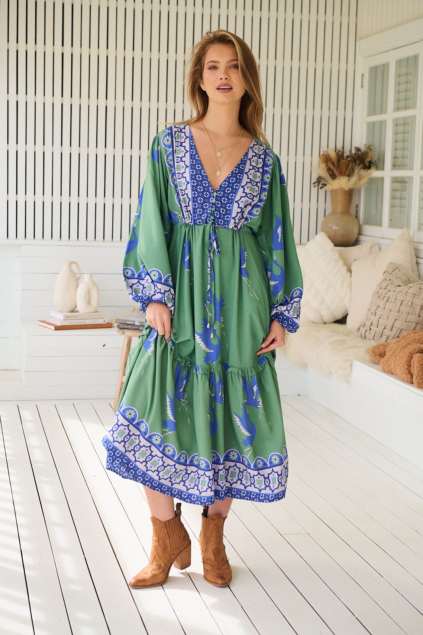 Model wearing Bluebird Willa Boho Midi Dress by Jaase - floral print, long sleeves, 100% rayon, relaxed fit.