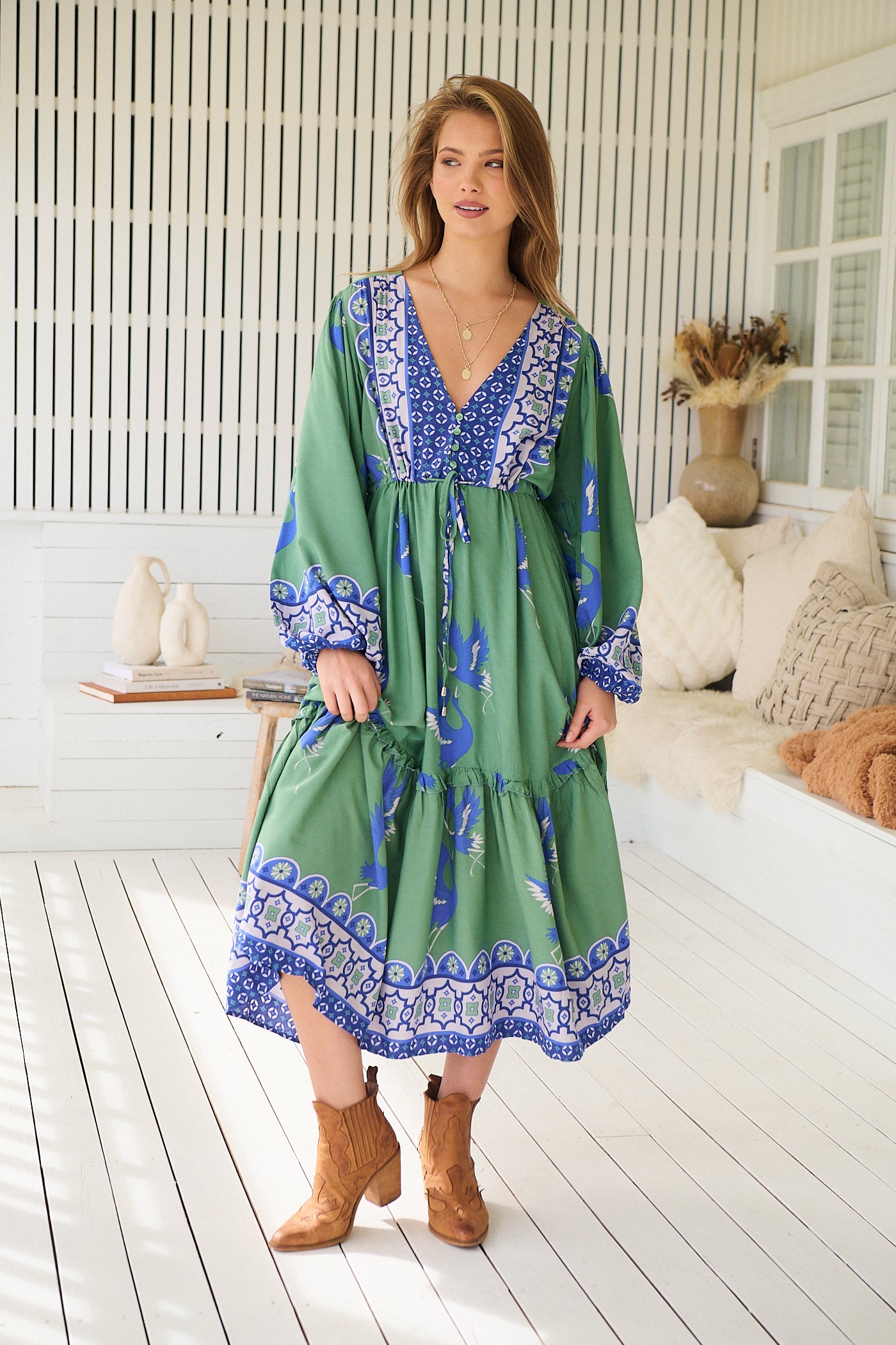 Model wearing Bluebird Willa Boho Midi Dress by Jaase - floral print, long sleeves, 100% rayon, relaxed fit.
