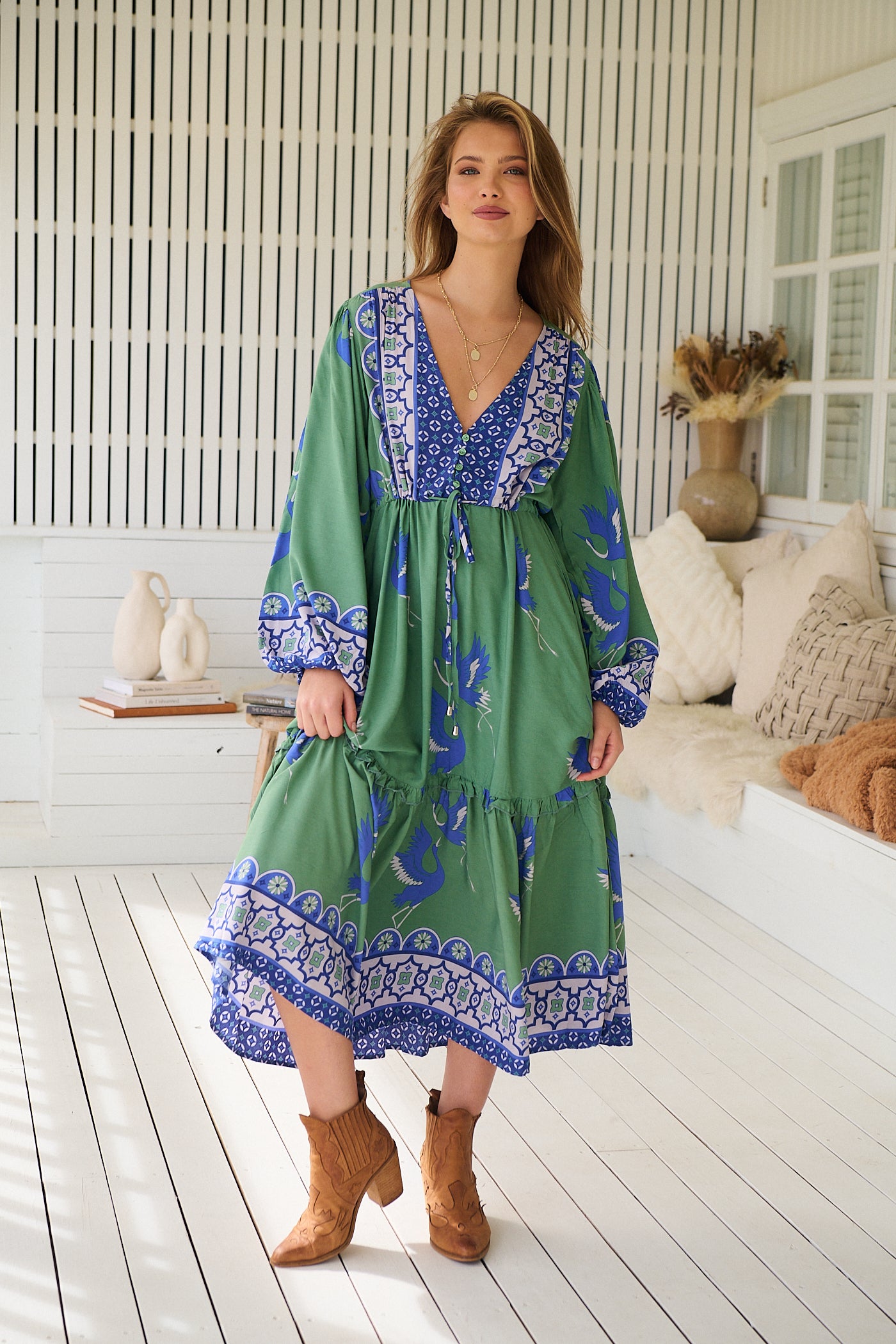 Model wearing Bluebird Willa Boho Midi Dress by Jaase - floral print, long sleeves, 100% rayon, drawstring waist.