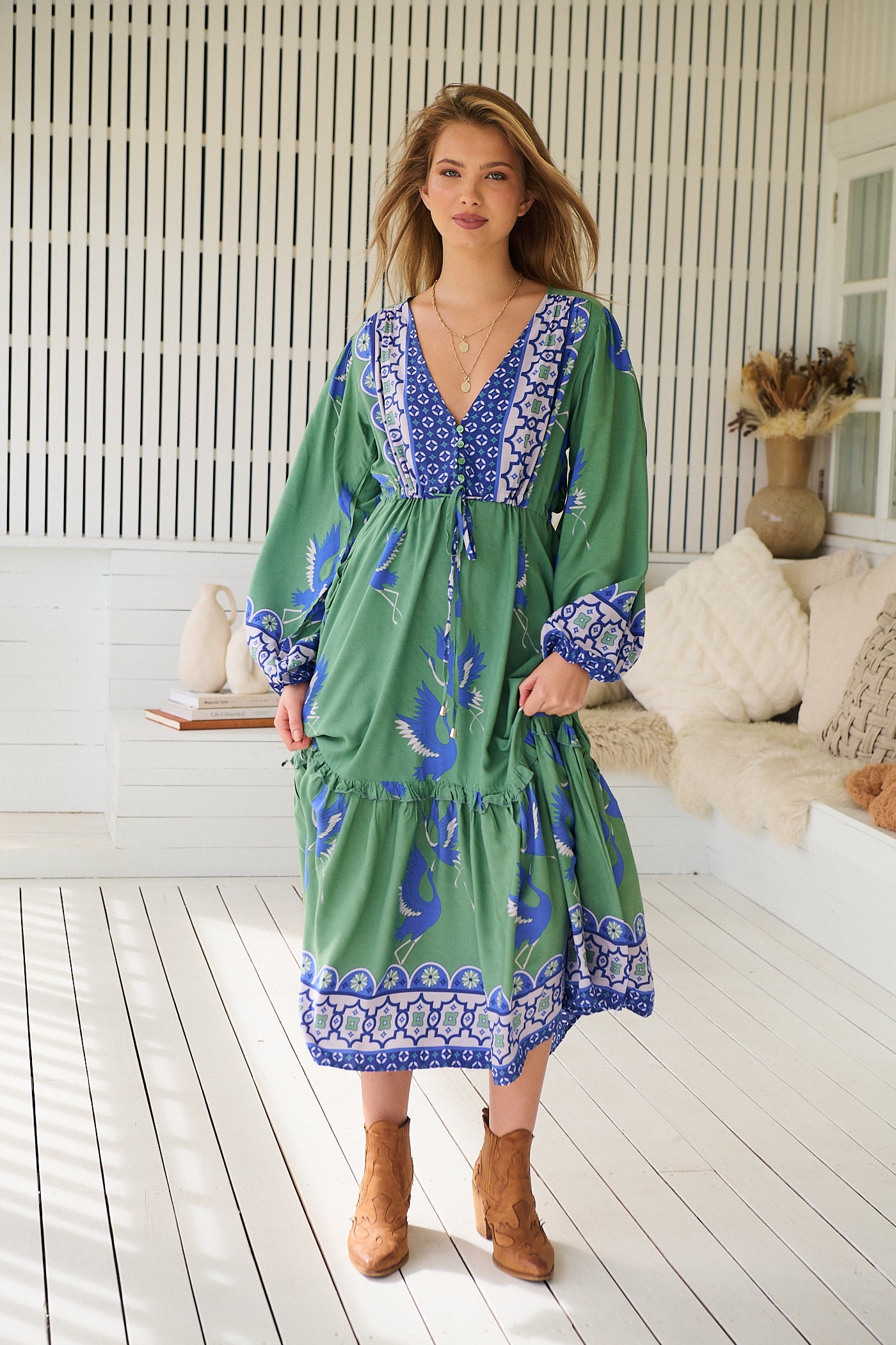 Model wearing Bluebird Willa Boho Midi Dress by Jaase - floral print, long sleeves, 100% rayon, drawstring waist.