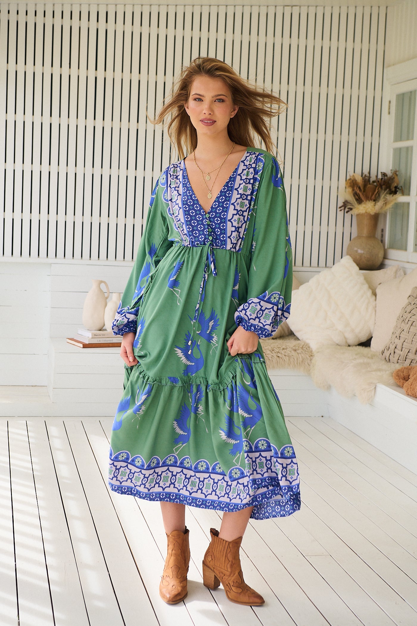 Model wearing Bluebird Willa Boho Midi Dress by Jaase - floral print, long sleeves, 100% rayon, drawstring waist.