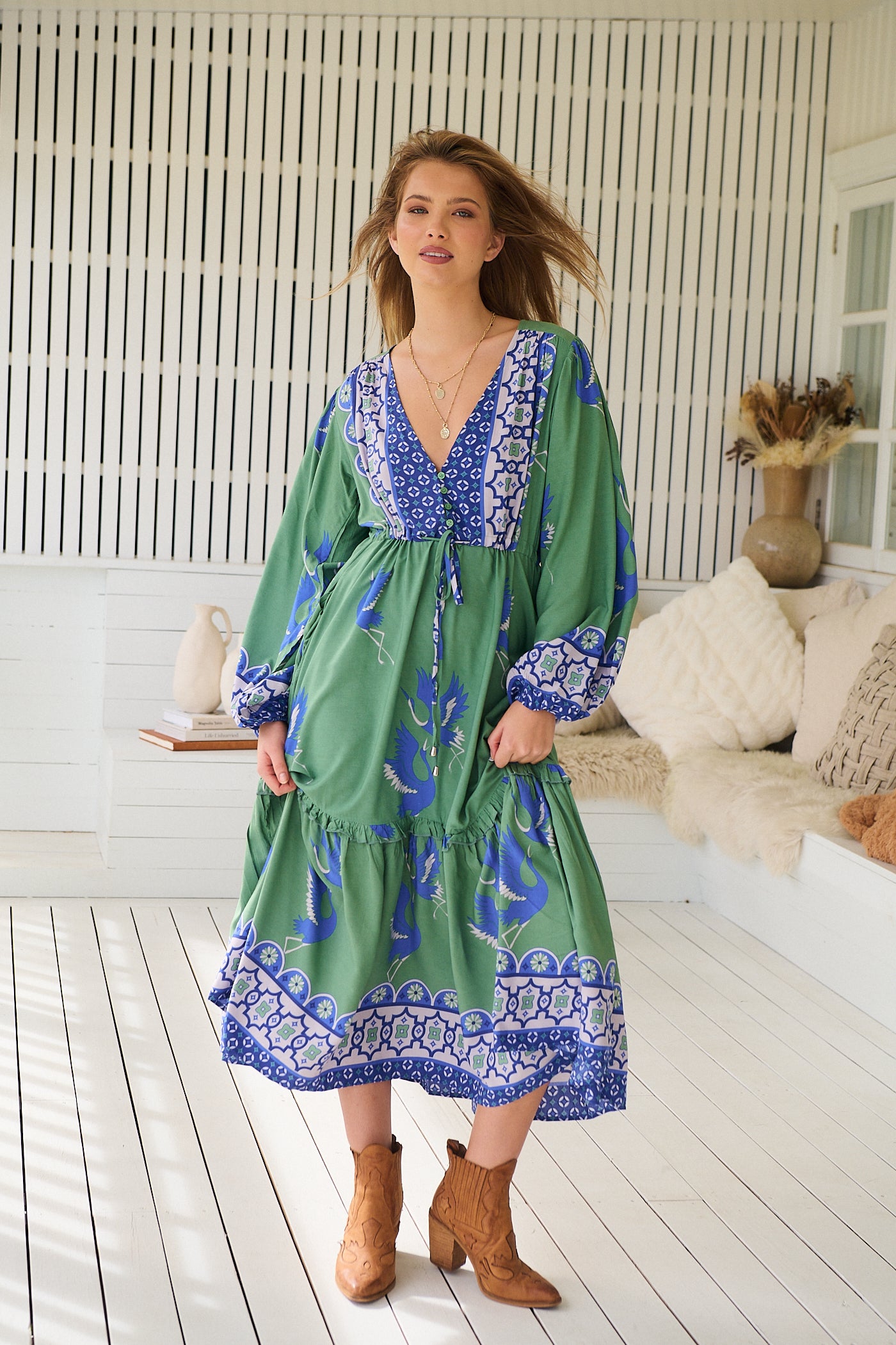 Model wearing Bluebird Willa Boho Midi Dress by Jaase - floral print, long sleeves, 100% rayon, drawstring waist.
