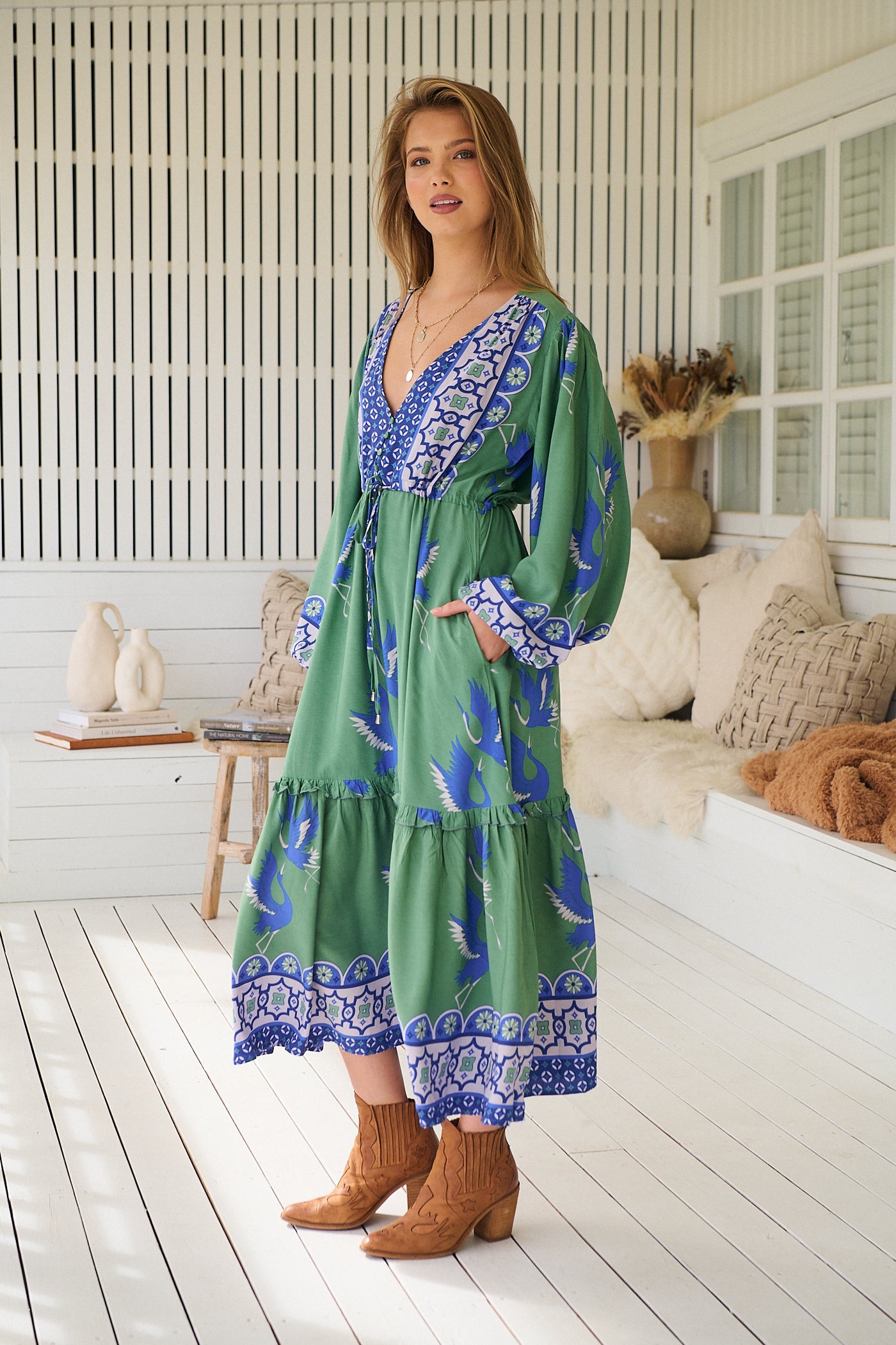 Model wearing Bluebird Willa Boho Midi Dress by Jaase - floral print, long sleeves, 100% rayon, drawstring waist.