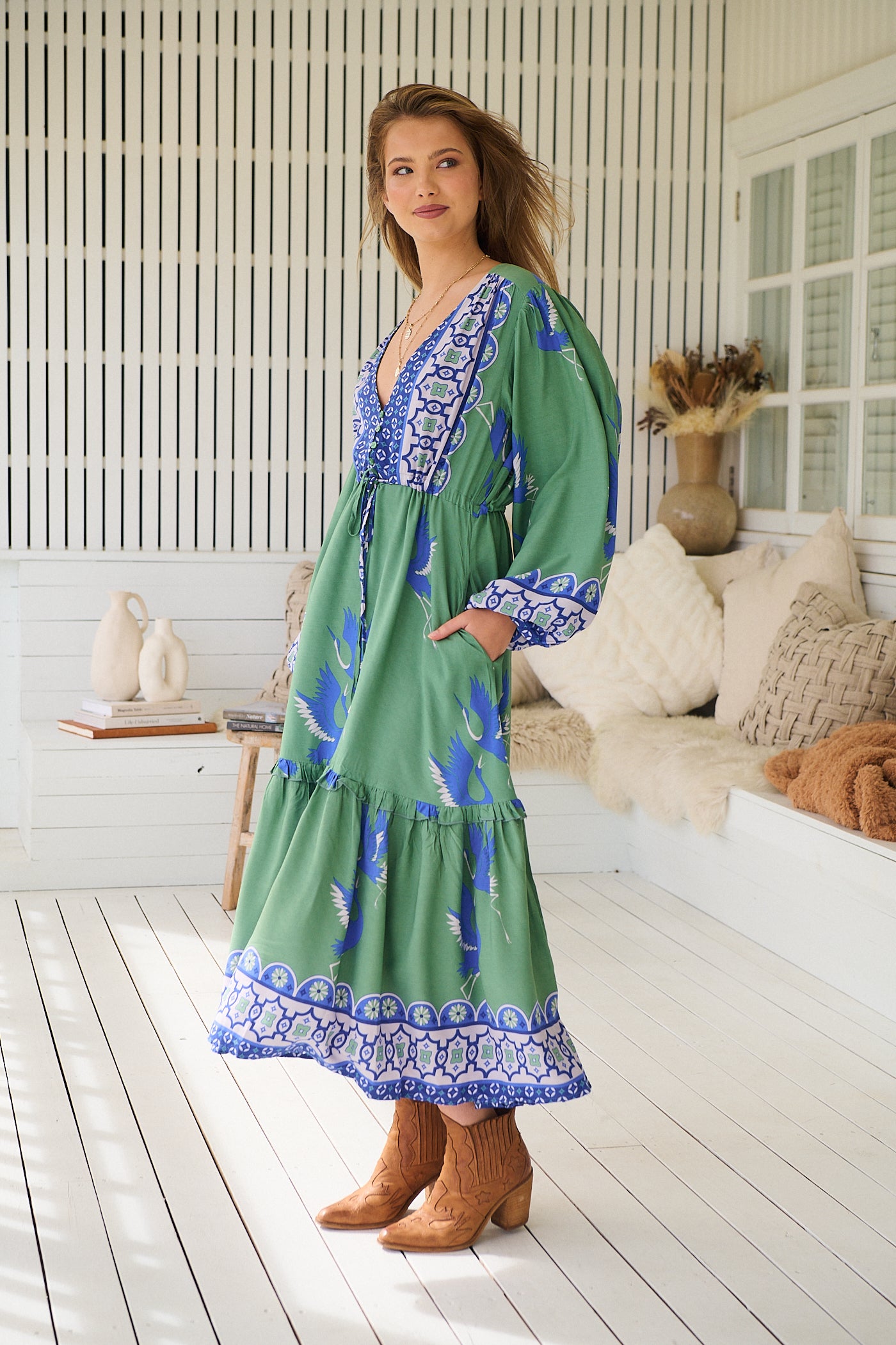 Model wearing Bluebird Willa Boho Midi Dress by Jaase - floral print, long sleeves, 100% rayon, drawstring waist.