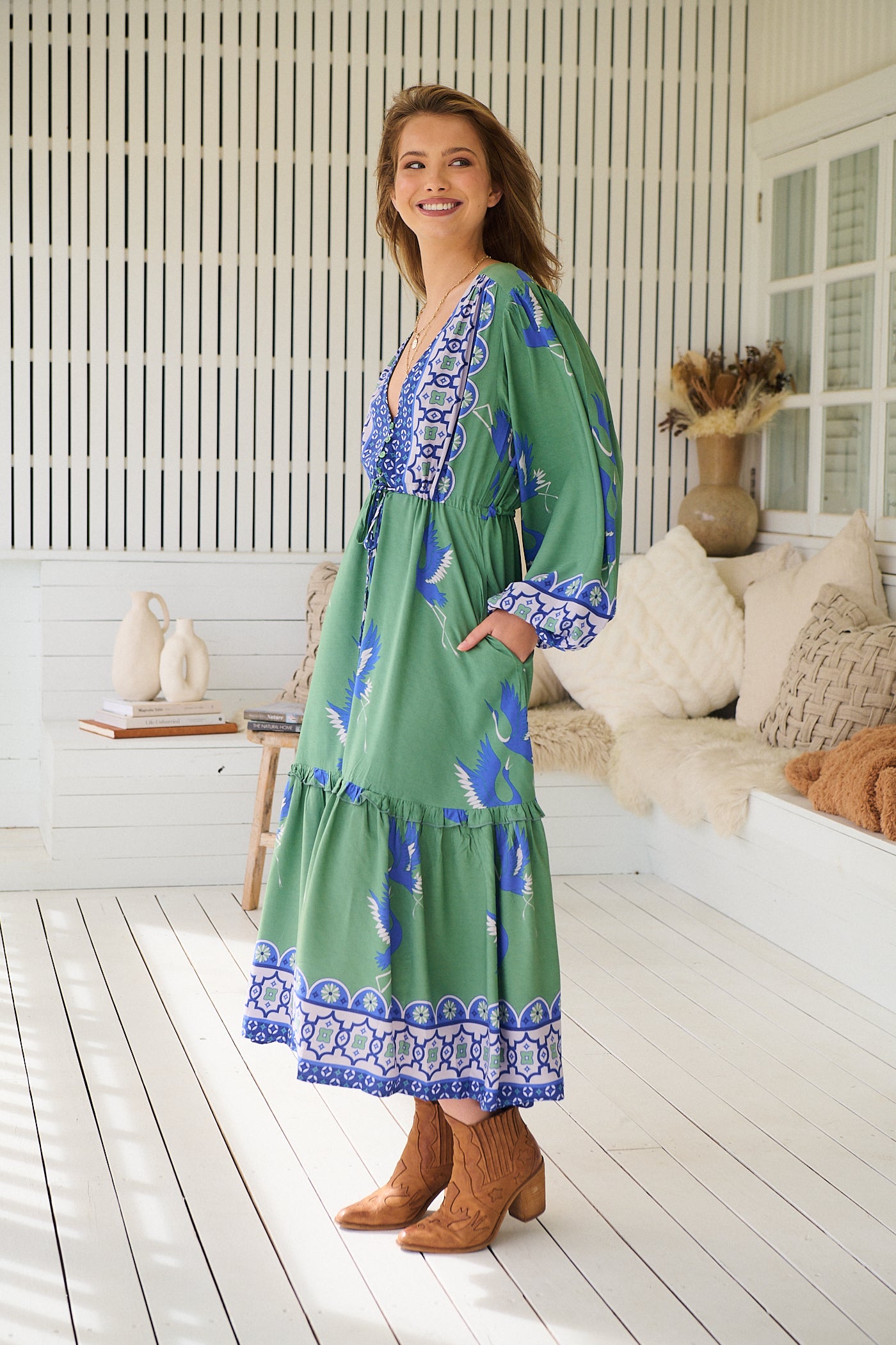 Model wearing Bluebird Willa Boho Midi Dress by Jaase - floral print, long sleeves, 100% rayon, drawstring waist.