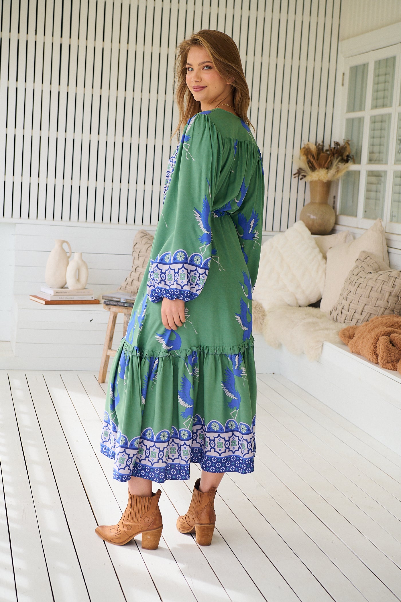 Model wearing Bluebird Willa Boho Midi Dress by Jaase - floral print, long sleeves, 100% rayon, drawstring waist.