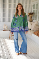 Model wears rayon Boho blouse with vintage print - feminine & effortless