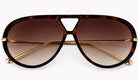 Woman wearing Jacqueline oversized aviator sunglasses in brown tortoiseshell with gradient lenses