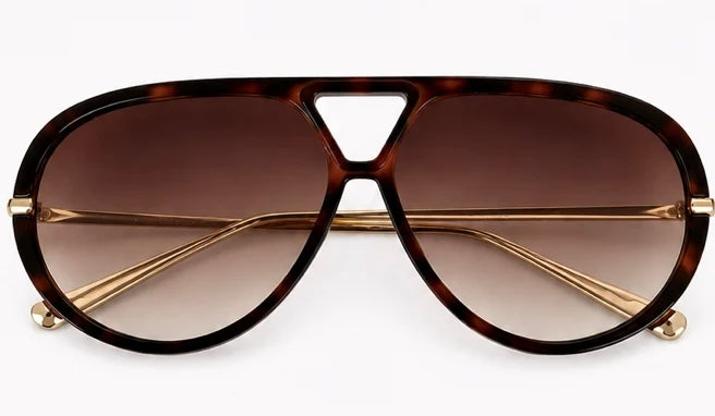 Woman wearing Jacqueline oversized aviator sunglasses in brown tortoiseshell with gradient lenses